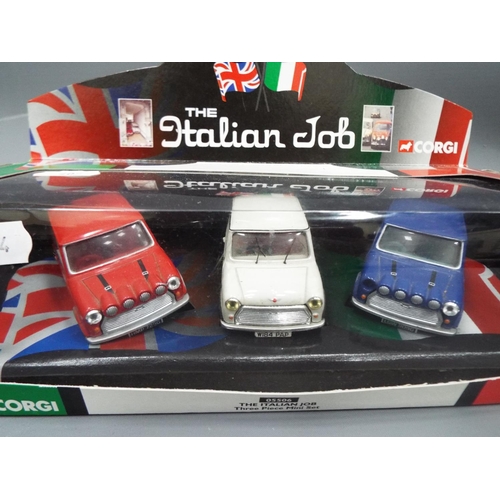 405 - New Ray die cast model of a Mini cooper set in a perspex box together with a Corgi Italian Job, thre... 