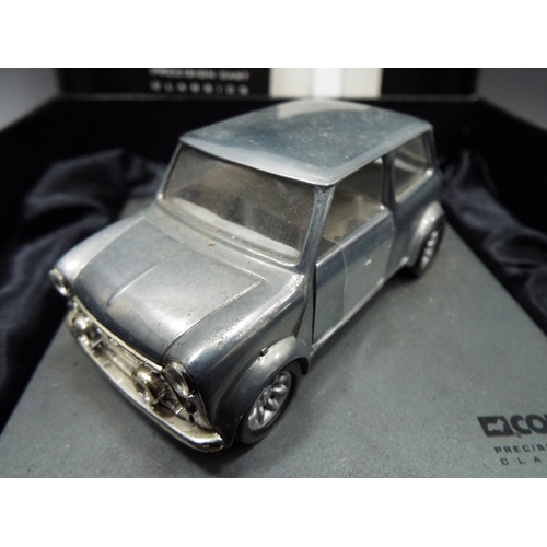 408 - Corgi precision cast model of an Austin Mini with silk lined box. See photos