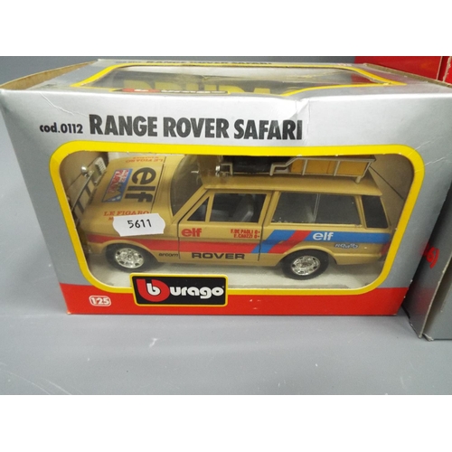 430 - Two Die cast metal Burago vintage cars plus a Range Rover Safari Set. All boxed and unused, see phot... 