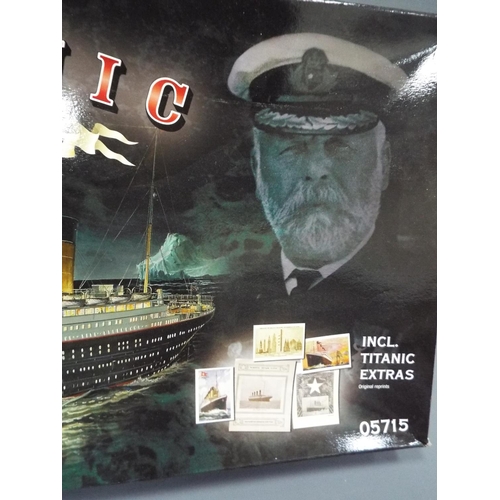 446 - Revill 1:400 scale boxed kit form model of the Titanic. Parts are contained in plastic bags within t... 