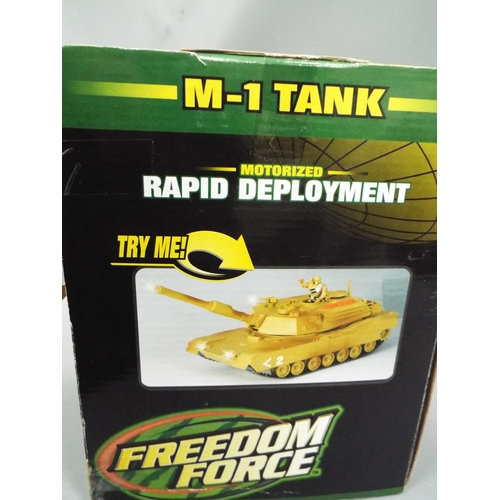 450 - Freedom Force  M1 Tank with effects. Boxed and unused, may need batteries to operate. See photos.