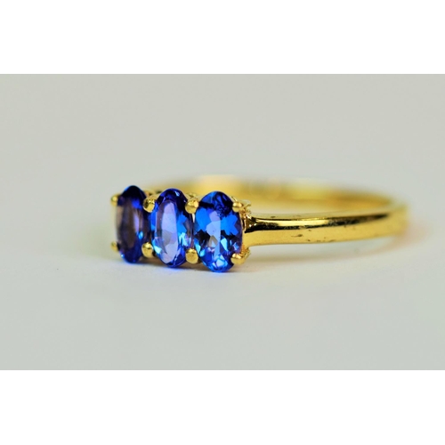 505 - 9ct Yellow Gold ring set with a trio of deep Blue Crystals each of 4 x 3 mm.  Finger size 'M'    1.7... 