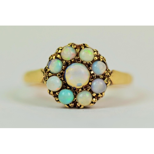 510 - 9ct Yellow Gold Ring set with Pale Blue Opals in a flower pattern. Finger size 'M'   2.0g