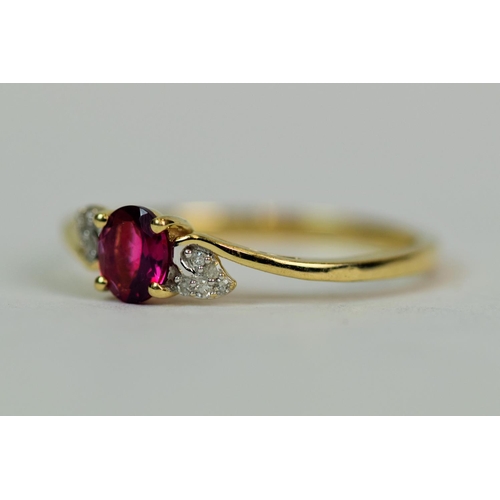 515 - 9ct Yellow Gold Ring set with a central Red Amethyst ( 5 x 4 mm) and Diamonds to shoulders. Finger s... 