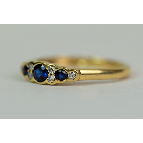 516 - 9ct Yellow Gold Ring set with Three  Deep Blue Sapphires plus six Diamonds @ 1.5mm each. Approx 0.01... 