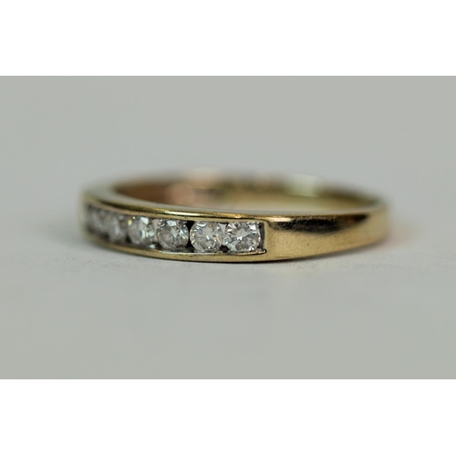 523 - 18ct Yellow Gold ring set with seven Diamonds each of 0.03ct each.  Finger size 'K'  1.5g