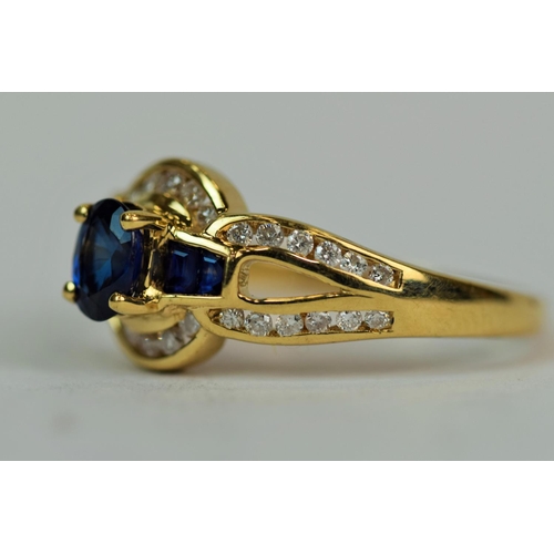 527 - 18ct Yellow Gold Ring set with a stunning Deep Sapphire (6 x 4mm) flanked by two smaller baguette cu... 