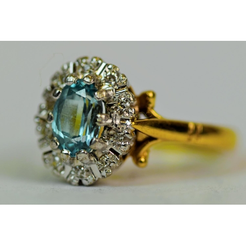 529 - 18ct Yellow Gold Ring set with a Central Oval Cut Topaz (7 x 5 mm, 0.75ct) surrounded by 12 Diamonds... 