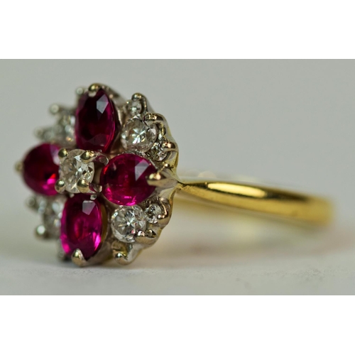 530 - 18ct Yellow Gold Ring set with Four Oval Cut Rubies, each of 4 x 3 mm surrounded by 13 Brilliant Cut... 