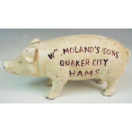 87 - Reproduction cast iron pig money box. WM. MOLANDS quaker city hams.