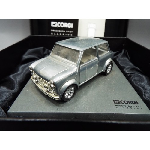 408 - Corgi precision cast model of an Austin Mini with silk lined box. See photos