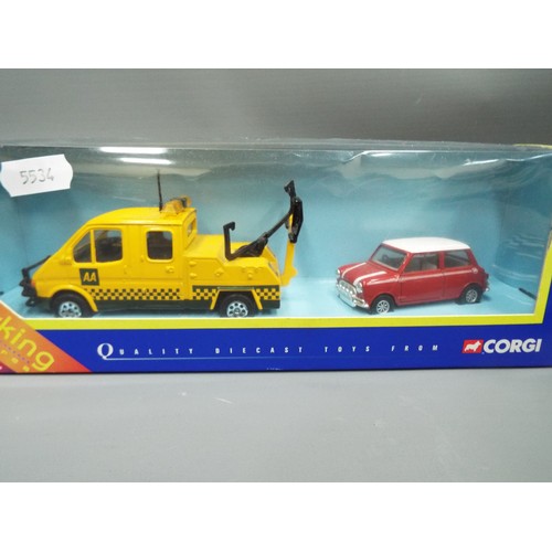 402 - Corgi ltd Edition die cast model of a John Cooper challenge Mini Cooper together with a Corgi road r... 