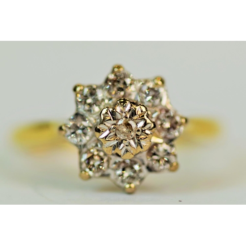 544 - 18ct Yellow Gold Ring set with 9 Diamonds in a flower pattern (smaller illustion set centre diamond ... 