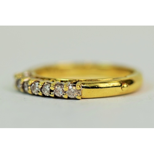 551 - 9ct Yellow Gold Ring set with 7 Diamonds.  1/4 Eternity style.   Approx 0.25pts Diamonds, finger siz... 