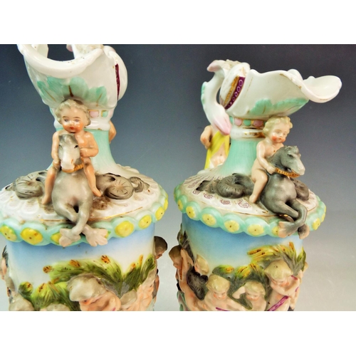 119 - Antique pair of Sitzendorf mythological porcelain ewers  A/F