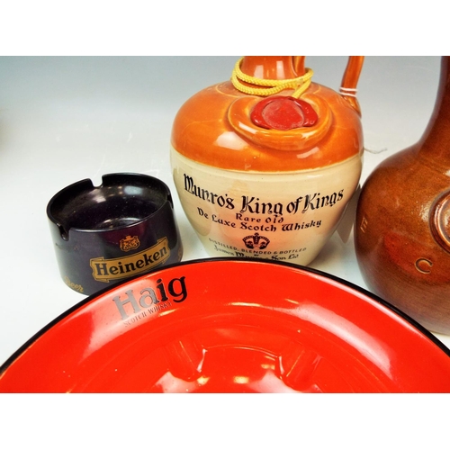 128 - Selection of whiskey and ale advertising jugs and ashtrays.