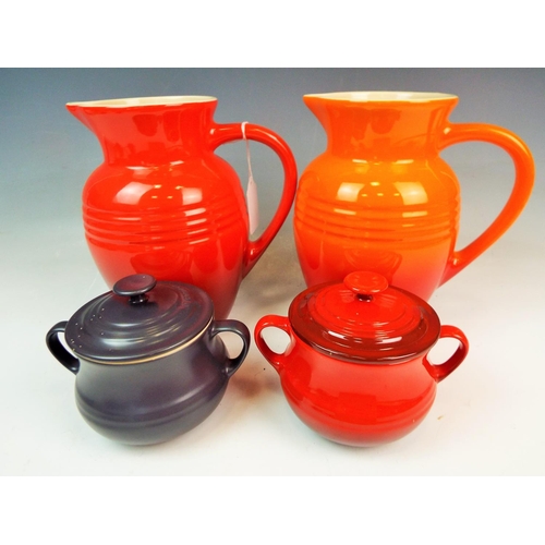 133 - 2 LE Creuset large jugs & 2 lidded pots.