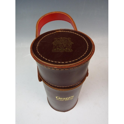 160 - A Grants Scotch whiskey leather travel decanter holder with original glass decanters.