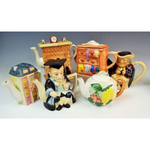 164 - A Selection of novelty teapots.