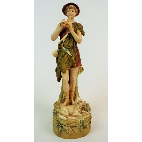 169 - Royal Dux bisque figurine of a shepherd playing a flute. 12.5