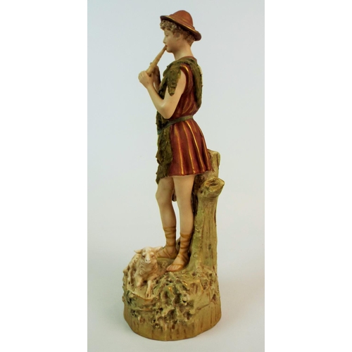 169 - Royal Dux bisque figurine of a shepherd playing a flute. 12.5