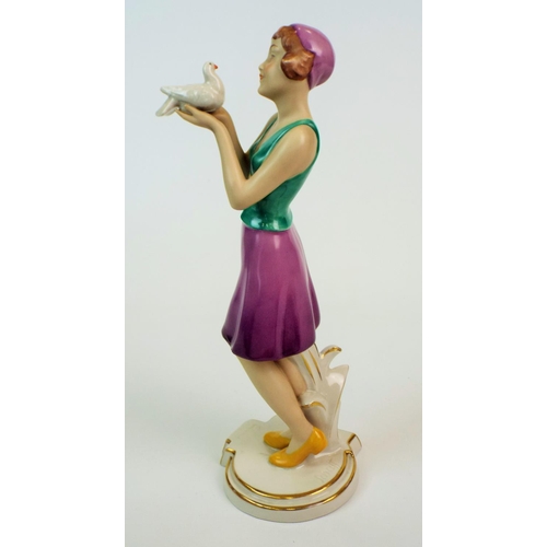 173 - Royal dux figurine of a art deco lady standing holding a dove, 11.5