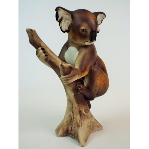 174 - Large Royal Dux bisque figurine of a koala resting on a branch, 11