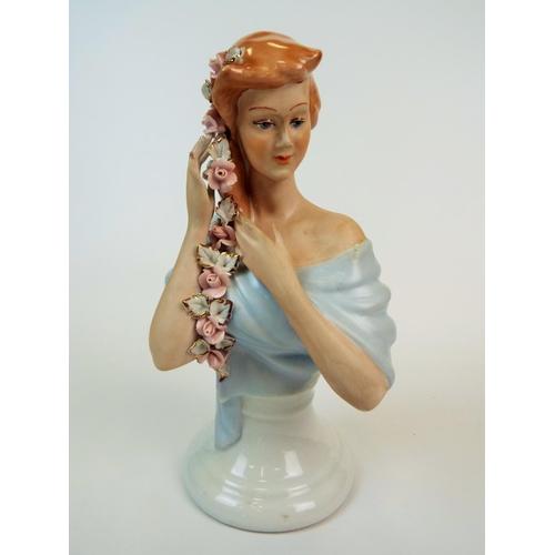 184 - A Apulum Lucru Manual porcelain bust of a lady with rose braided hair. 10