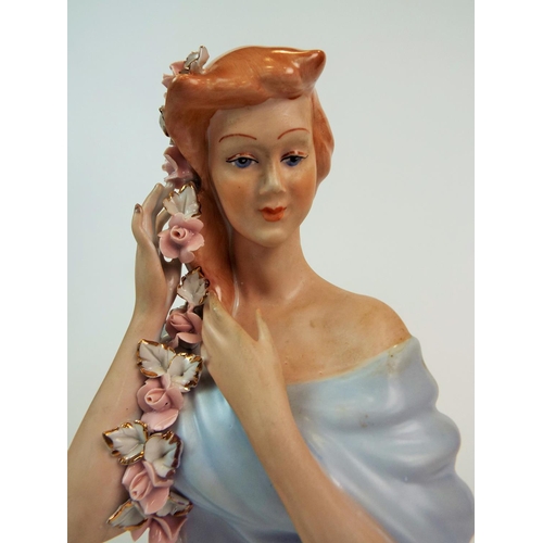 184 - A Apulum Lucru Manual porcelain bust of a lady with rose braided hair. 10