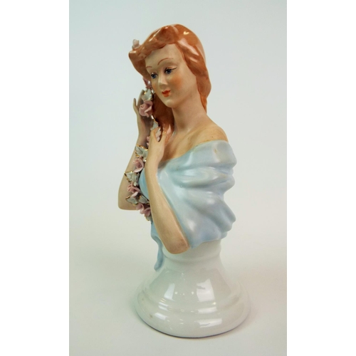 184 - A Apulum Lucru Manual porcelain bust of a lady with rose braided hair. 10