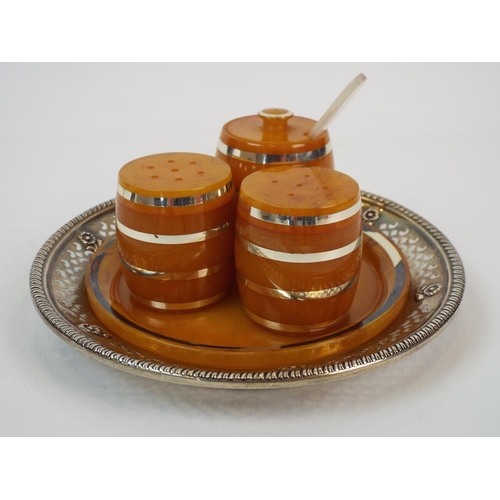 233 - Butterscotch lucite cruet set in the form of barrels.