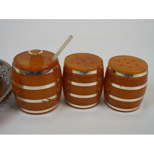 233 - Butterscotch lucite cruet set in the form of barrels.