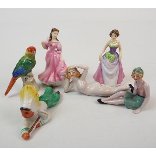 240 - 2 Royal Doulton miniature ladies and 4 other miniature ceramic figurines.