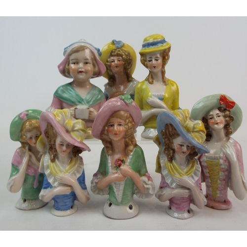 249 - 8 Vintage porcelain half dolls , pin cushion dolls. Tallest measures 10cm smallest 8cms.