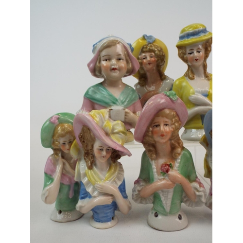 249 - 8 Vintage porcelain half dolls , pin cushion dolls. Tallest measures 10cm smallest 8cms.