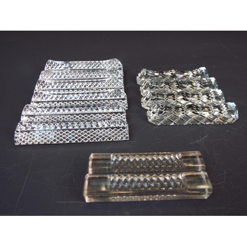 276 - 12 Vintage crystal glass knife rests in 3 differect patterns.