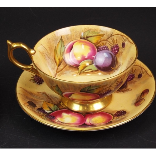 294 - Pair of Aynsley orchard gold cups and saucers.