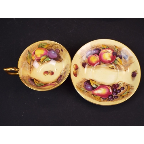 294 - Pair of Aynsley orchard gold cups and saucers.