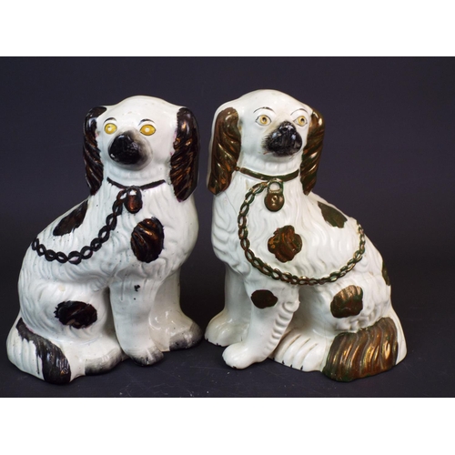 360 - Near pair of Staffordshire spaniels.