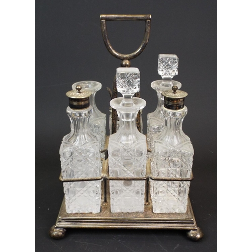 372 - Vintage cut glass cruet set in silver plated holder. 1 stopper is missing.