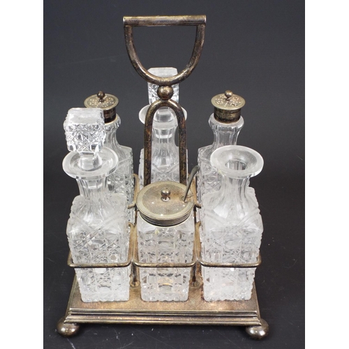 372 - Vintage cut glass cruet set in silver plated holder. 1 stopper is missing.