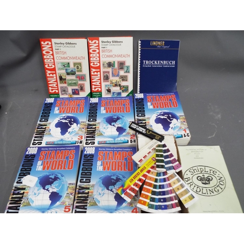 325 - Various volumes of Stanley Gibbons stamp catalogues plus colour charts etc.