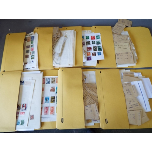 330 - Twelve  folders of loose and graded stamps plus album pages. See photos