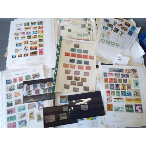 333 - Large tray of loose stamps and stamps on album pages. See photos