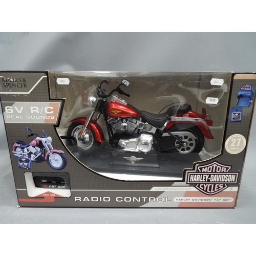 383 - Radio controlled Harley Davidson Motorcycle with real sounds. Made by Marks & Spencer, boxed and unu... 