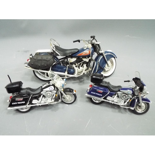 387 - Boxed die cast metal model of an Indian V Twin motorcycle plus two Harley Davidson patrol bikes. See... 