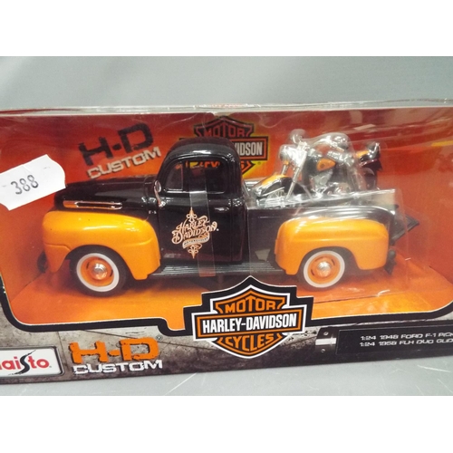 388 - Two boxed and unused Maisto Harley Davidson models of a 1948 Ford Pick up delivering a 1958 FLH Harl... 