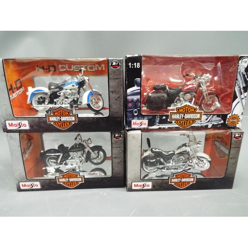 390 - Four 1:18 die cast models of Harley Davidson Motorcycles. All boxed and unused. See photo