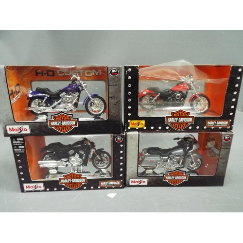 392 - Four 1:18 die cast models of Harley Davidson Motorcycles. All boxed and unused. See photo