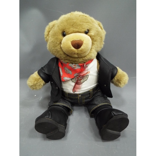 398 - Large Teddy bear dressed in Harley Davidson branded clothes. Approx 16 inches tall. See photos